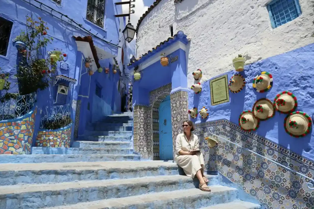 Blue alley in Chefchaouen, Morocco, with iconic blue-painted walls