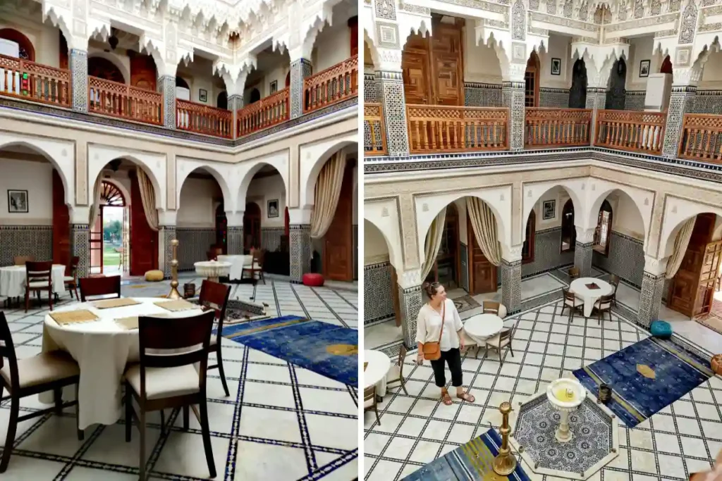 Intricate architecture of a traditional Moroccan riad courtyard with zellige tiles and marble fountain.